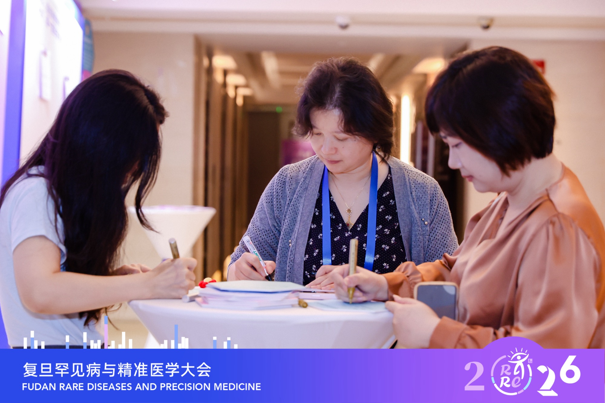 Lexaid team members writing notes at the conference